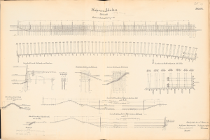 Ein aufgeschlagenes Buch mit detaillierten Zeichnungen und Texten eines Eisenbahnsystems, einschließlich einer Schienenweg-Illustration.