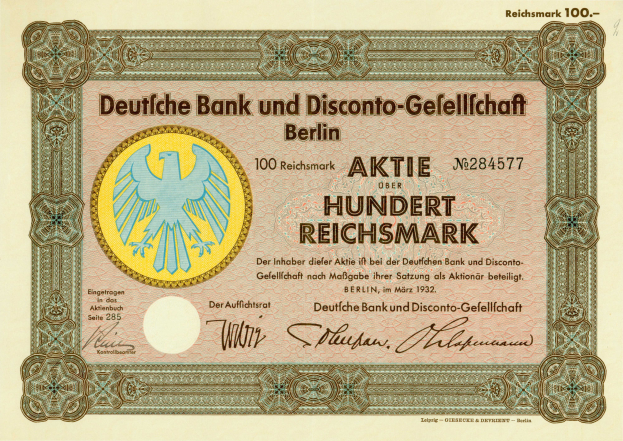 Eine alte deutsche Banknote mit einer Vogeldarstellung und dem Text "Deutsche Bank und Disconto-Gefellichaft Berlin".